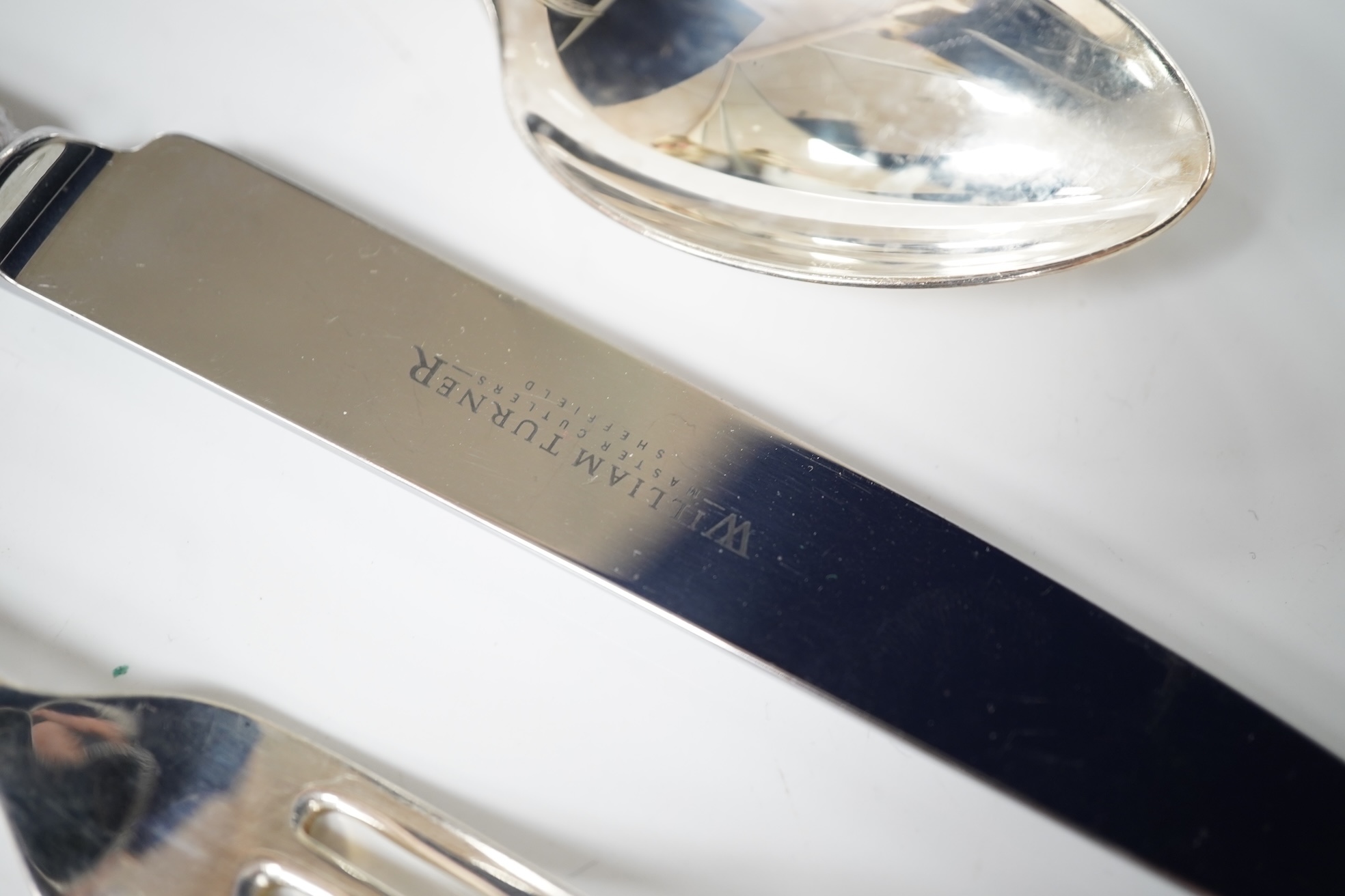 A George VI canteen of silver Hanoverian pattern flatware for six by Goldsmiths & Silversmiths Co Ltd, comprising dessert and table forks and soup and dessert spoons, Sheffield, 1944, 39.6oz, together with eight similar